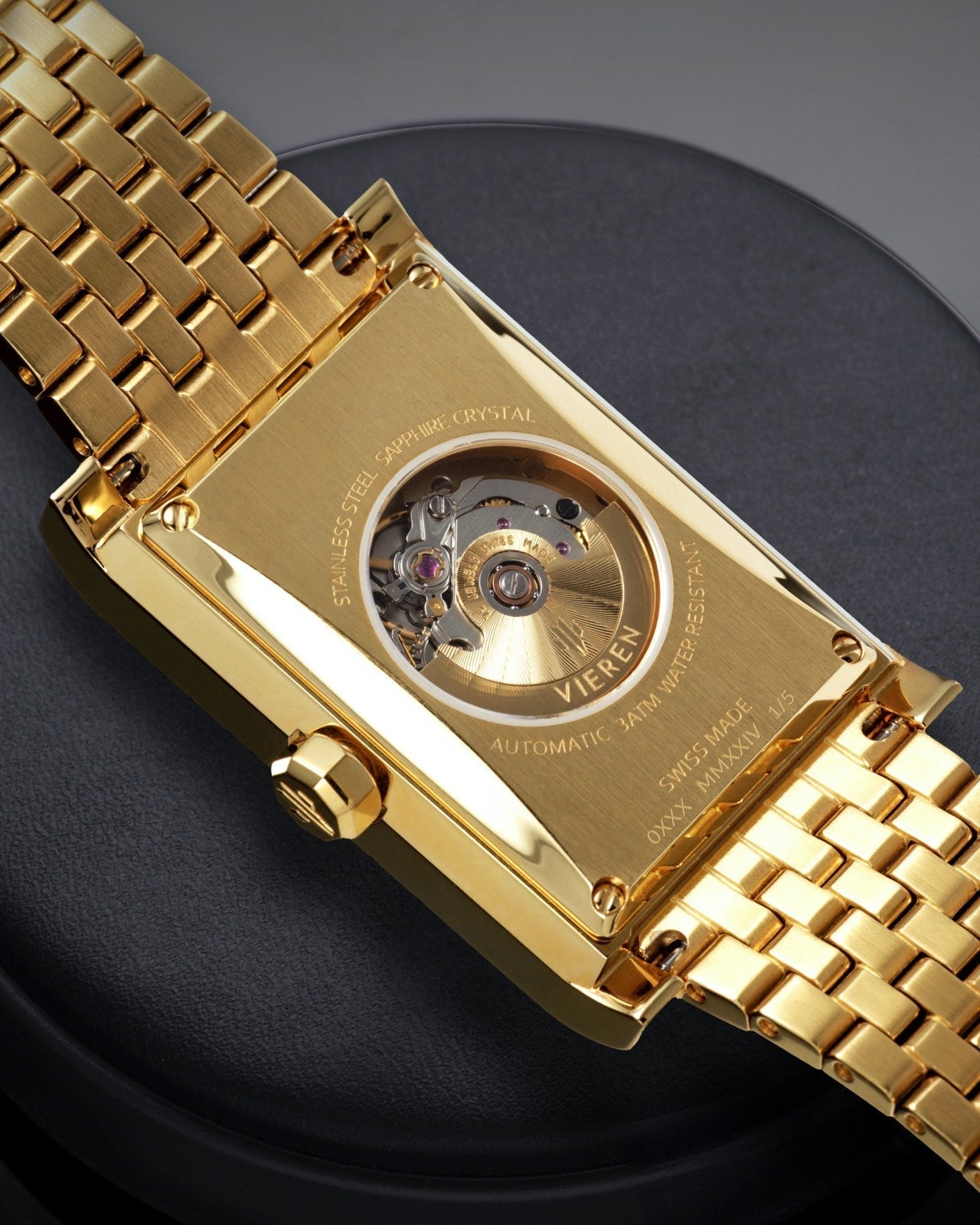 Luxury Swiss Made watch showing ETA 2671 automatic movement and gold rectangular caseback