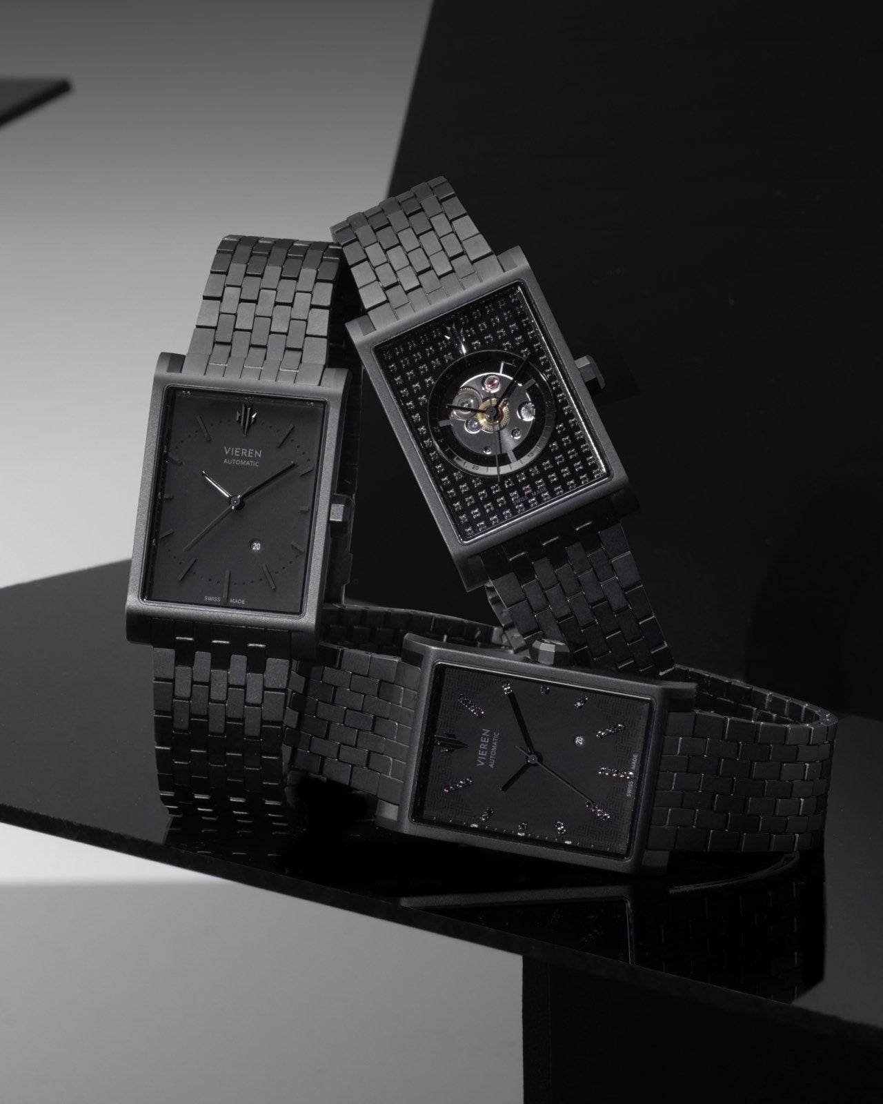 Luxury black rectangular watches featuring Swiss automatic movements and skeleton dials trio