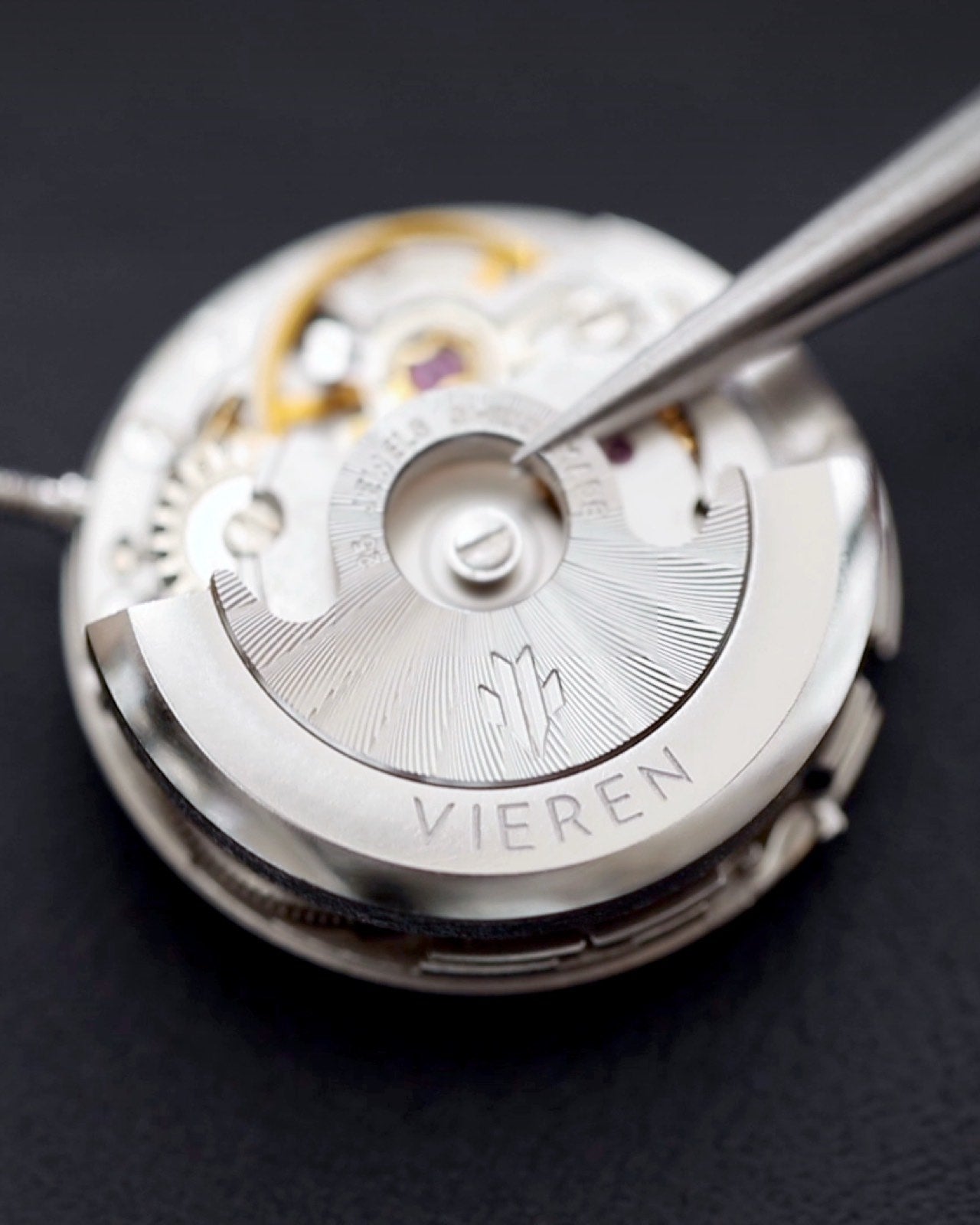 Closeup of Swiss ETA 2671 automatic movement with rotor being placed
