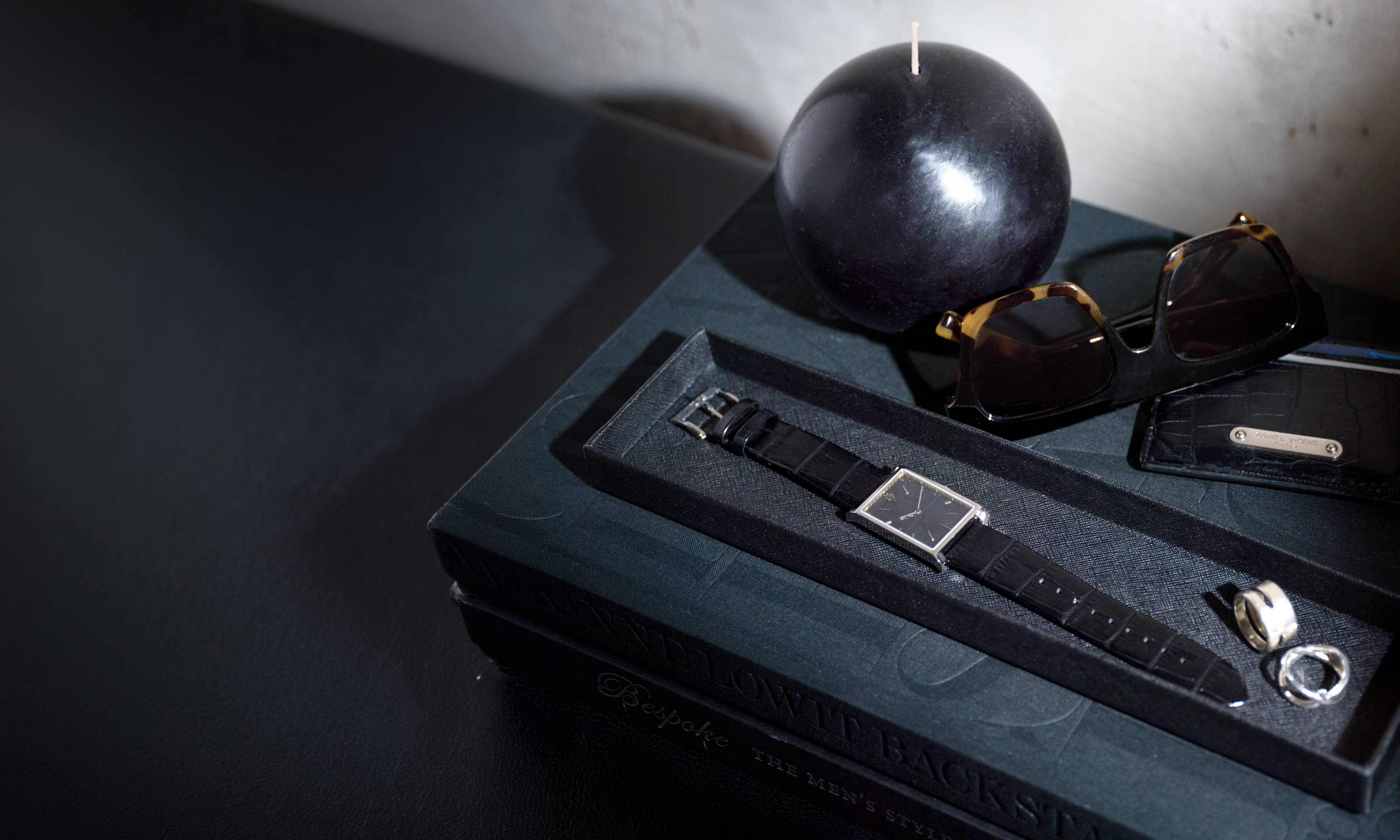 VIEREN Black Leather rectangular watch displayed on valet tray with accessories in a lifestyle setting