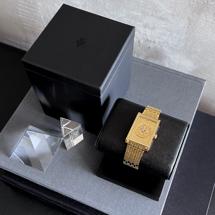 VIEREN gold rectangular watch displayed on stand with premium box set