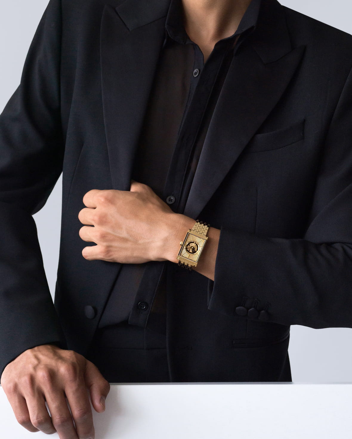 VIEREN Gold Waves men's rectangular watch styled with a black blazer