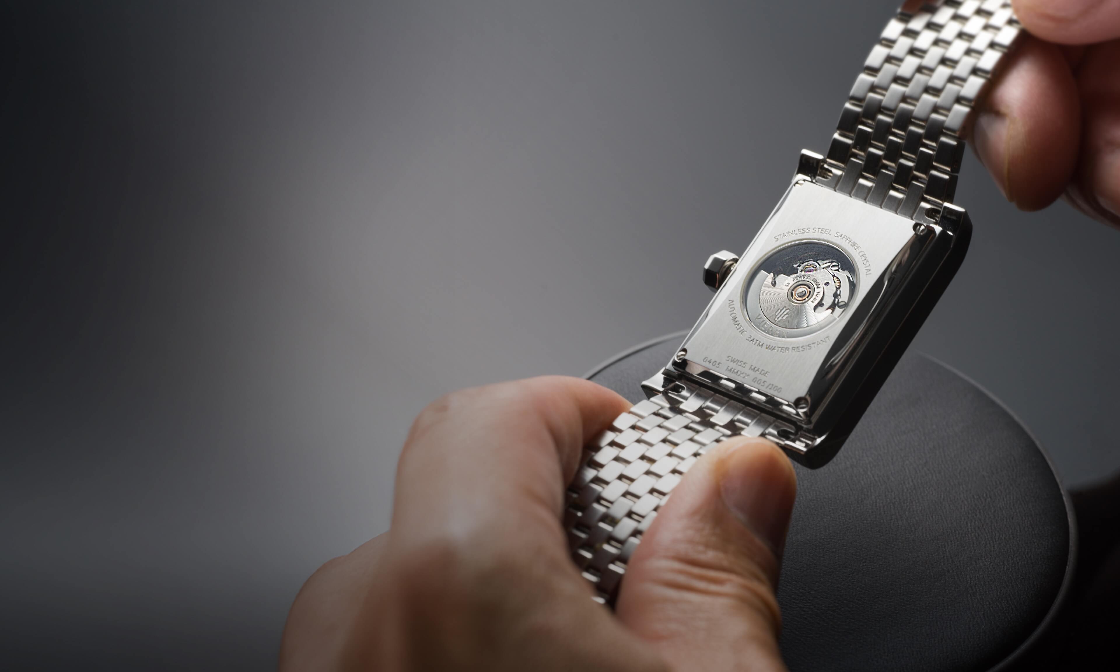 VIEREN silver rectangular watch caseback revealing Swiss Made automatic movement