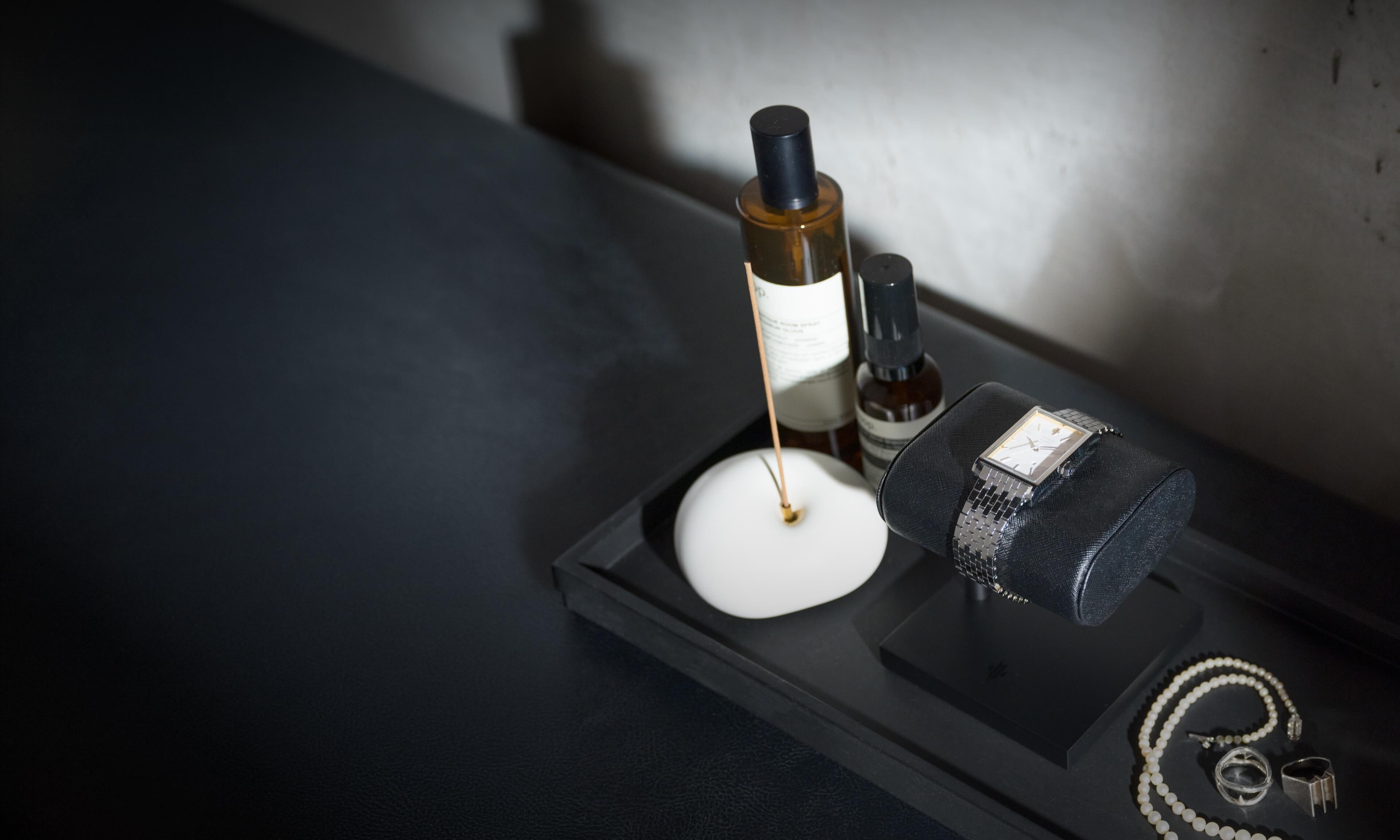 VIEREN stainless steel rectangular watch with accessories lifestyle setup on table and display stand