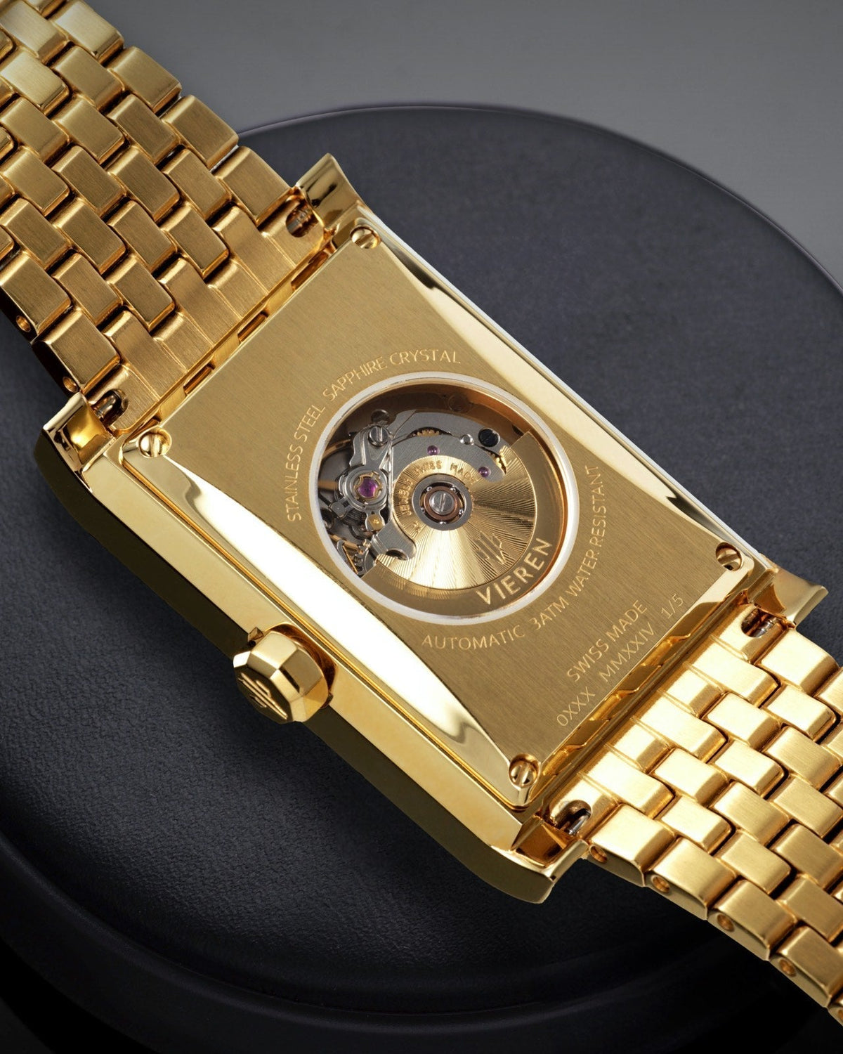 Luxury Swiss Made watch showing ETA 2671 automatic movement and gold rectangular caseback