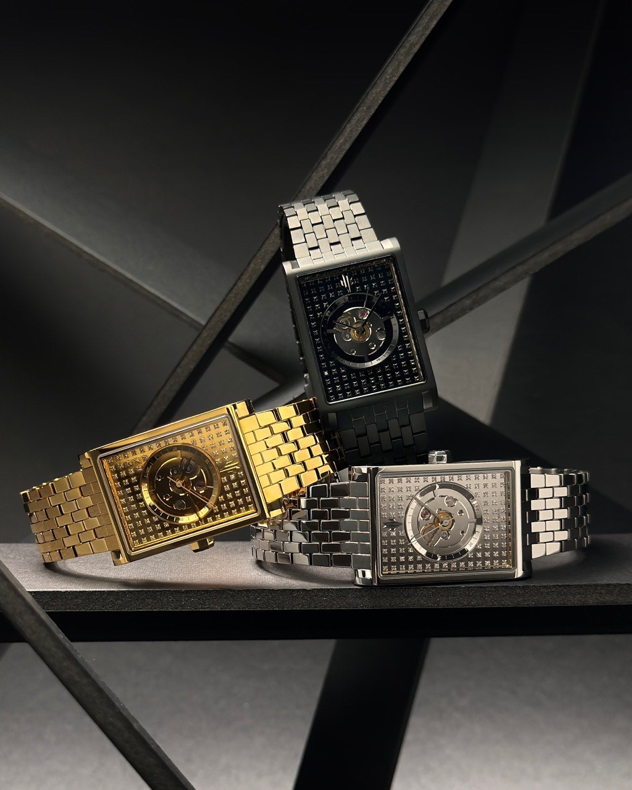 Luxury silver, black, and gold rectangular watches with diamond skeleton dials and Swiss automatic movements trio