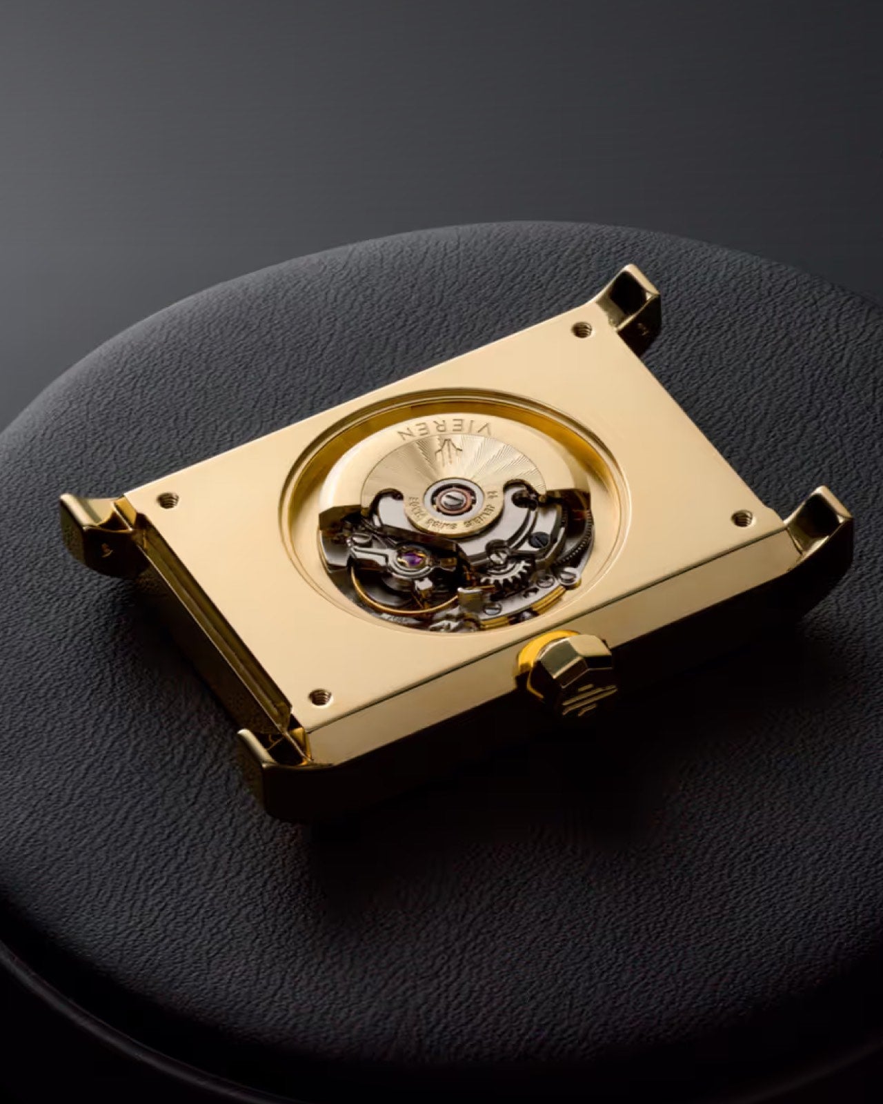 Luxury gold rectangular watch with Swiss Made automatic movement and caseback removed