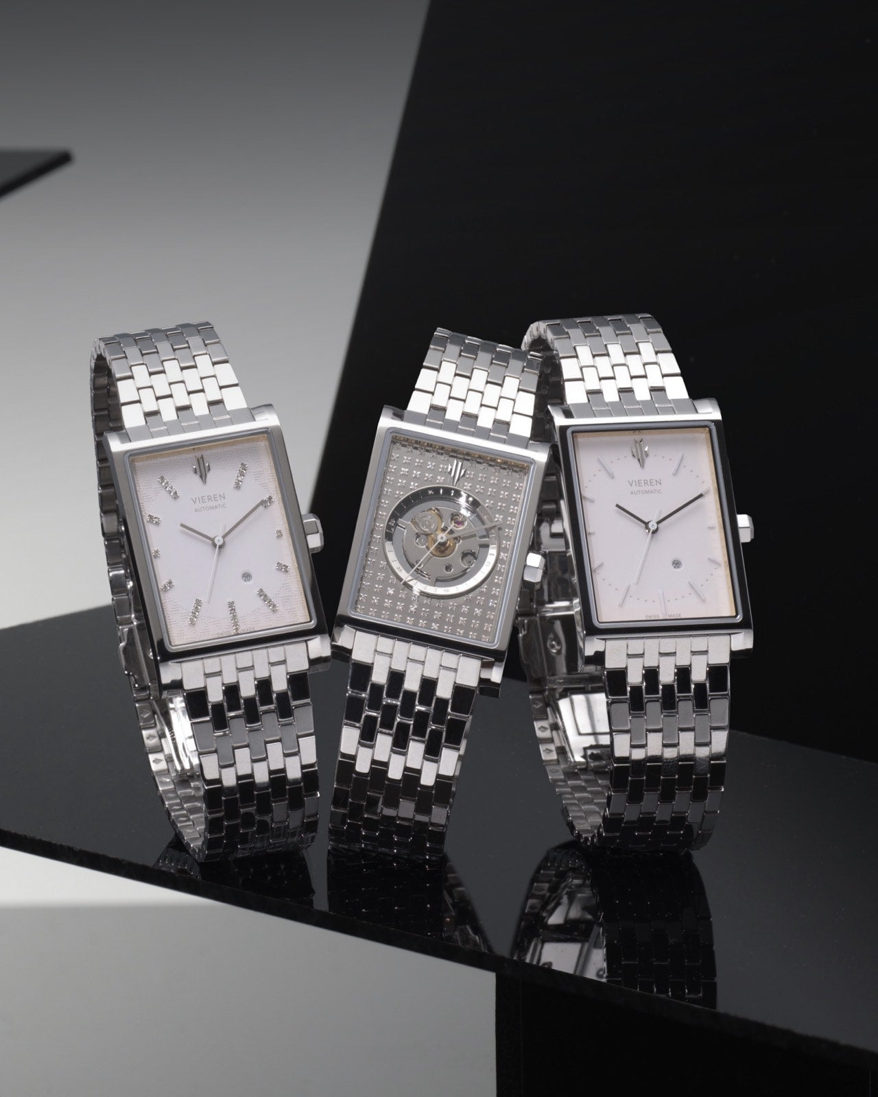 Luxury silver rectangular watches featuring Swiss automatic movements and skeleton dials trio