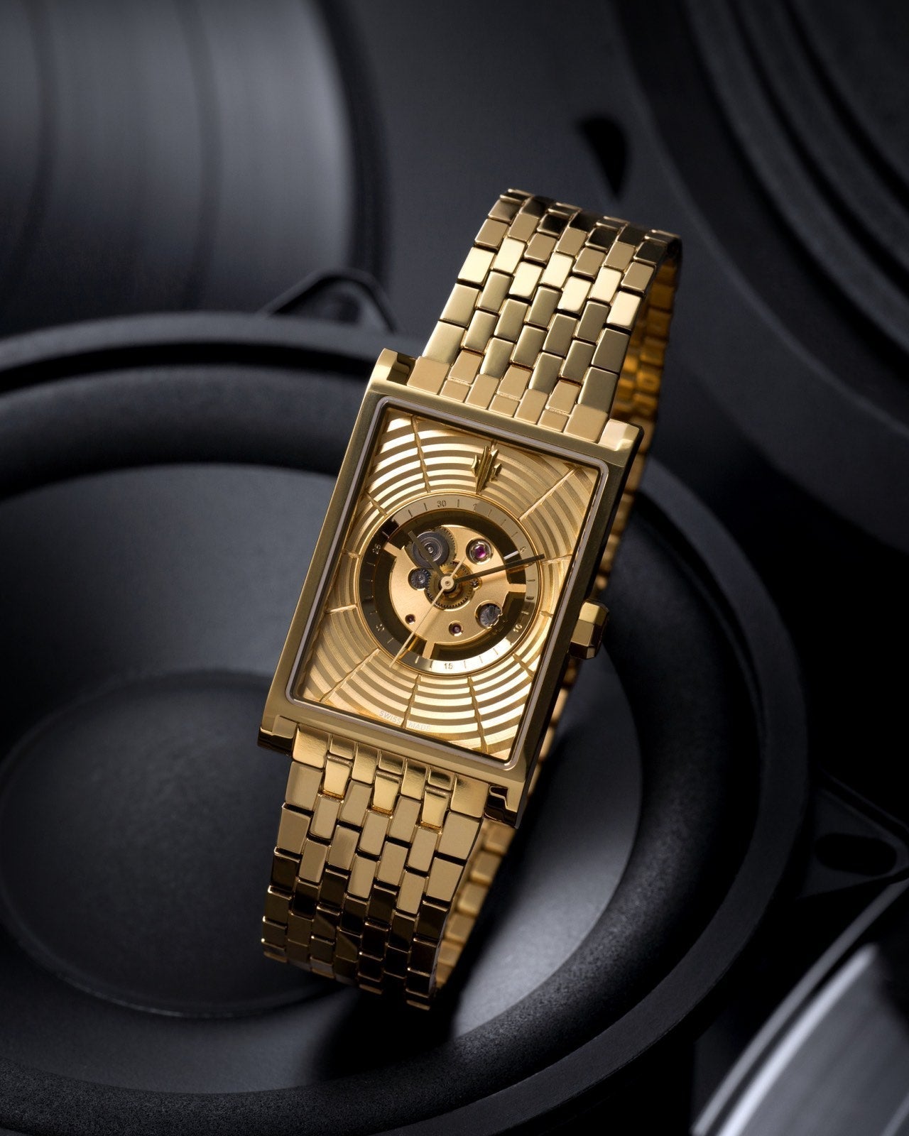 VIEREN gold Swiss automatic watch with rectangular case, skeleton dial, and speaker-inspired design