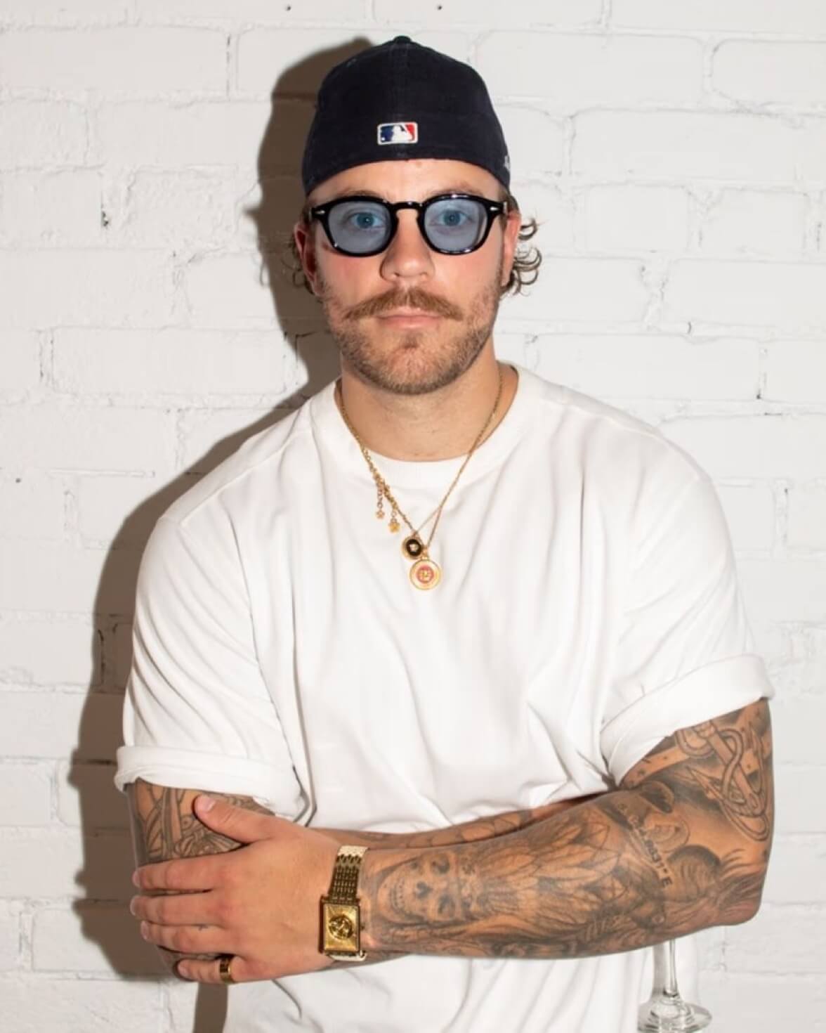 Devon Michaels wearing the VIEREN Gold Waves watch