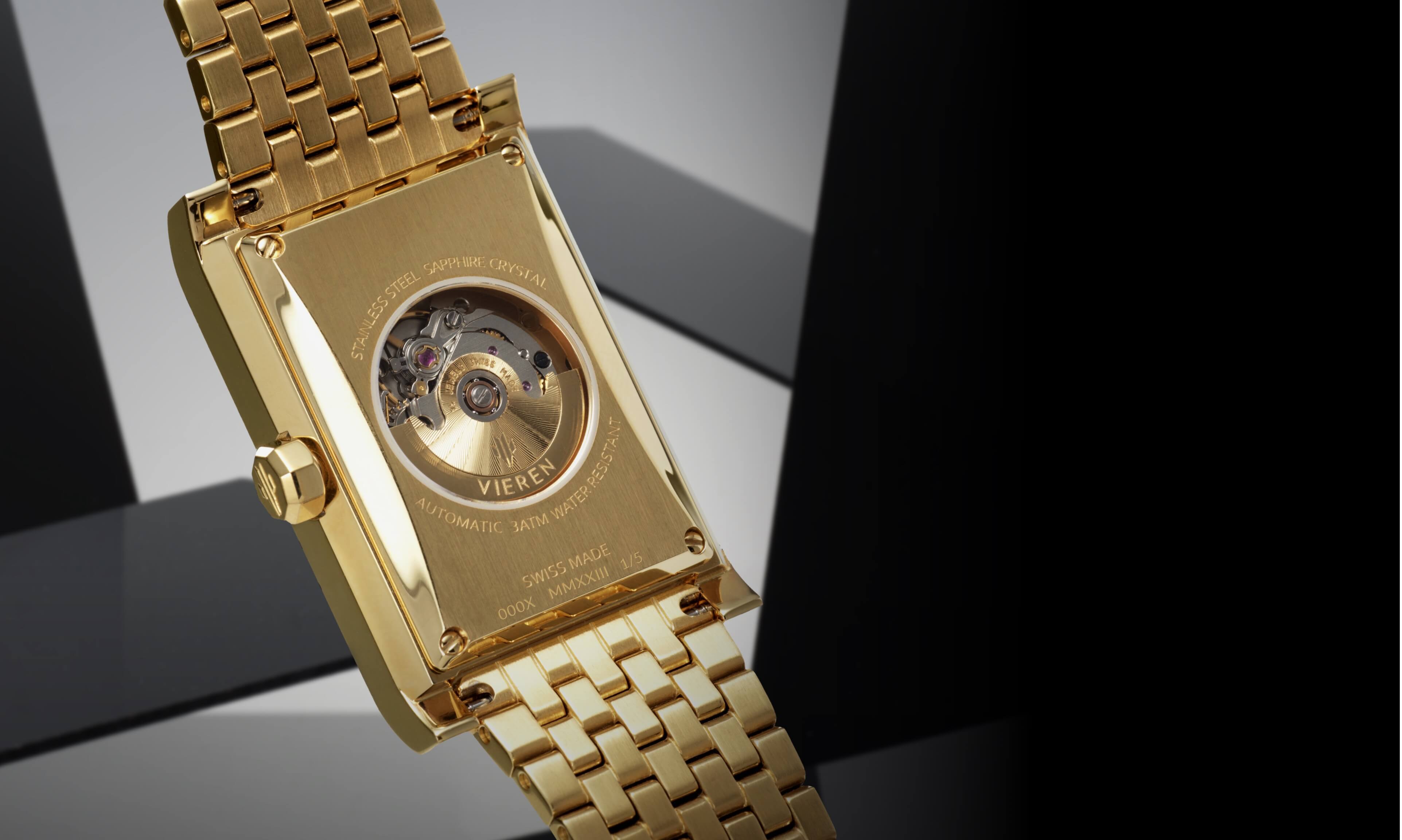 VIEREN gold rectangular watch caseback revealing Swiss ETA 2671 automatic movement