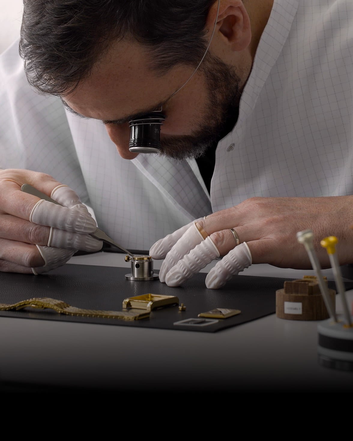 VIEREN Swiss watchmaker with loupe handcrafting Swiss Made automatic watch movement and parts
